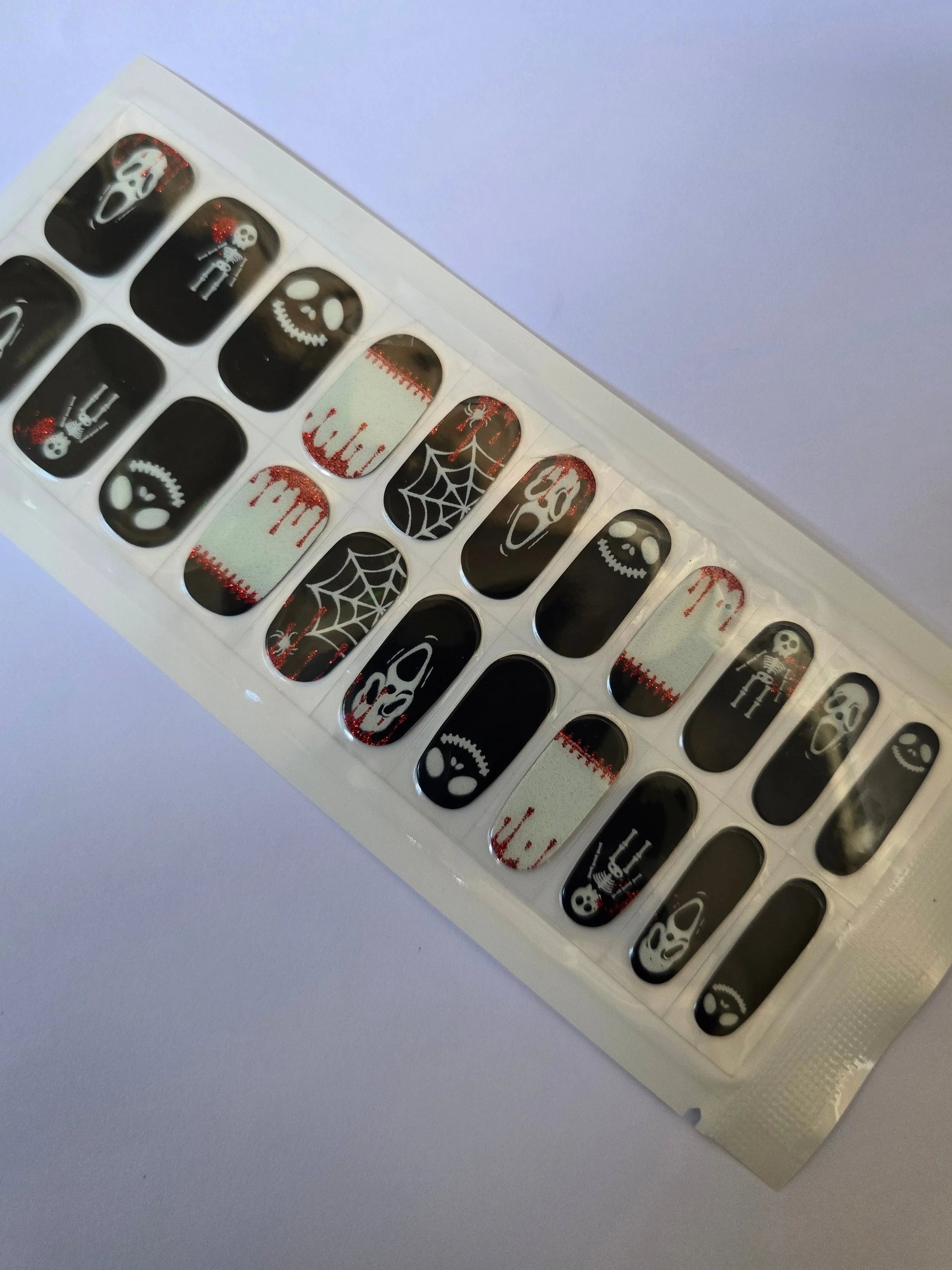 Spooky Black and White Halloween Nail Stickers: Perfect for a Frightfully Fun Manicure! www.swipeongel.com